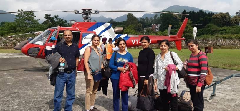 Travellers at helipad